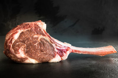 Raw, dry aged wagyu tomahawk steak