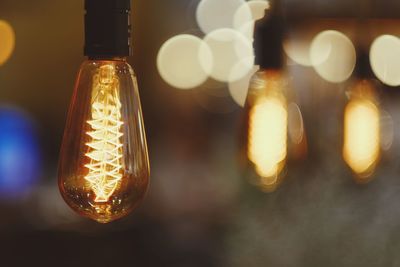 Close-up of illuminated light bulb