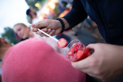 Close-up of person holding food in market