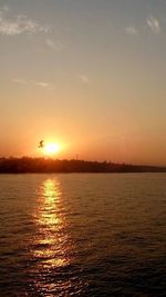 Scenic view of sea at sunset