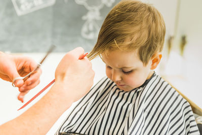 Boy getting haircut