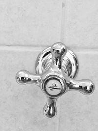 Close-up of faucet in bathroom