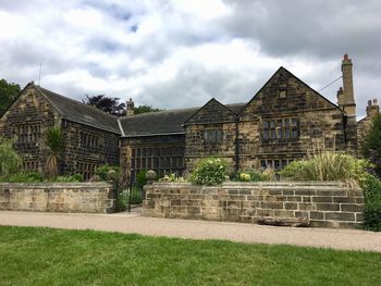 Exterior of house on field against sky