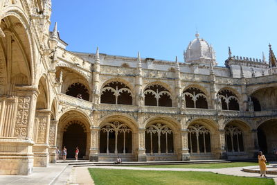 Facade of historic building against clear sky