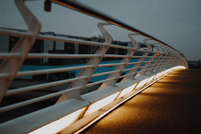 Close-up of walkway railing, perspective