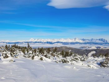 Scenic view of snowcapped mountains against sky