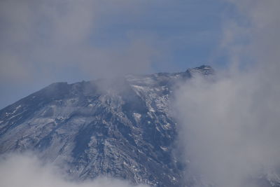 Aerial view of volcanic mountain against sky