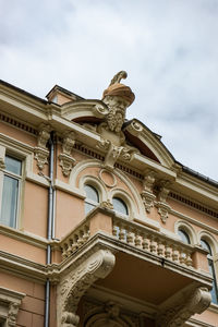 Low angle view of ornate building against sky