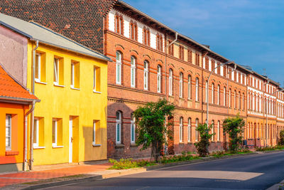 Street amidst buildings against sky