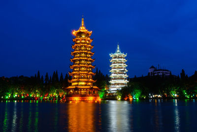 Illuminated buildings at waterfront