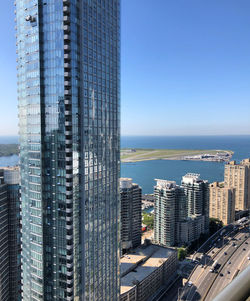 Modern buildings in city against clear sky