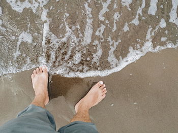 Low section of man on beach