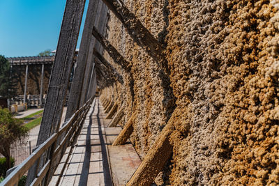 Footpath by wall of building