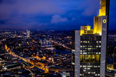 Illuminated buildings in city at night