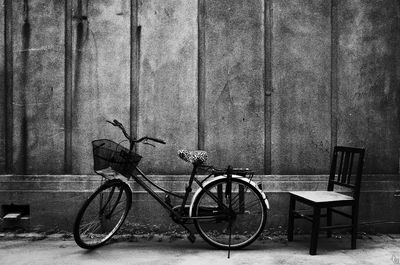 Bicycle parked against wall