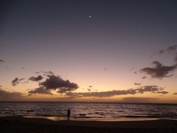 Scenic view of sea at sunset