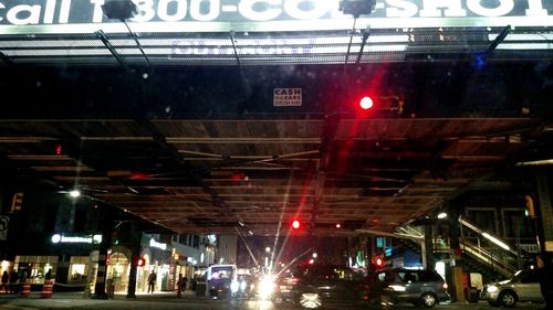 Cars on road in city at night