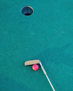 Golf club and ball by hole