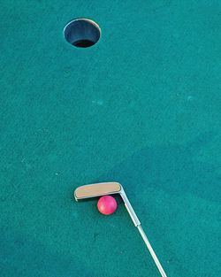 Golf club and ball by hole