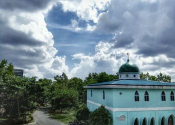 Built structure against cloudy sky