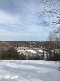 Scenic view of field against sky during winter