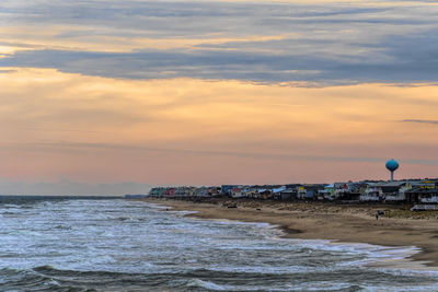 View from the pier looking at beach town and water