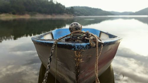 Boat moored in lake