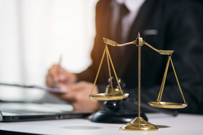 Close-up of clock on table