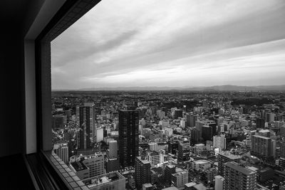 High angle view of buildings in city against sky