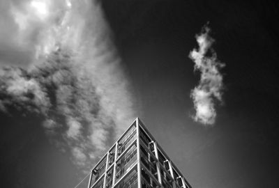 Low angle view of building against cloudy sky
