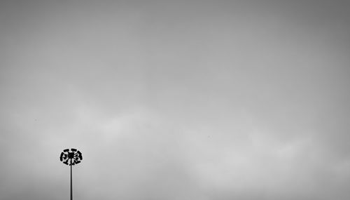 Low angle view of floodlight against sky