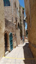 Narrow alley amidst buildings in town