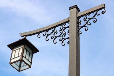 Low angle view of chinese lamp against sky