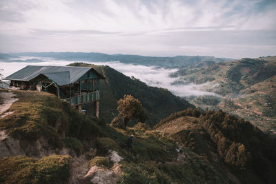 Panoramic view of buildings and mountains against sky