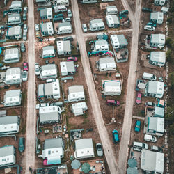 Aerial view of caravans and cars parked on road