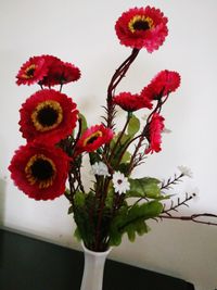Close-up of red flowers in vase
