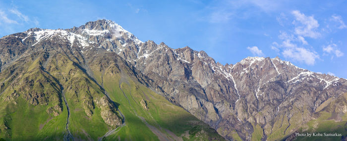 Panoramic view of snowcapped mountains against sky