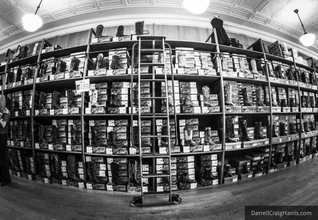 LOW ANGLE VIEW OF ILLUMINATED LIGHTING EQUIPMENT IN LIBRARY