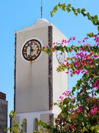 Low angle view of bell tower against sky