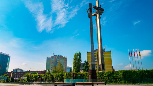 Low angle view of buildings against blue sky