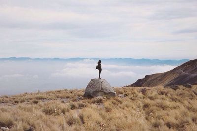 Silhouette of woman standing on landscape