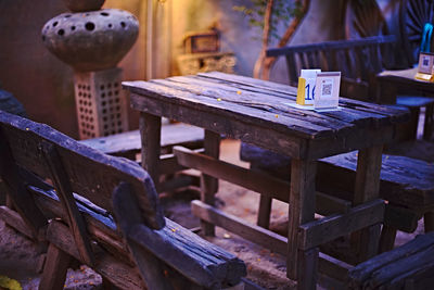 Empty chairs and tables at sidewalk cafe