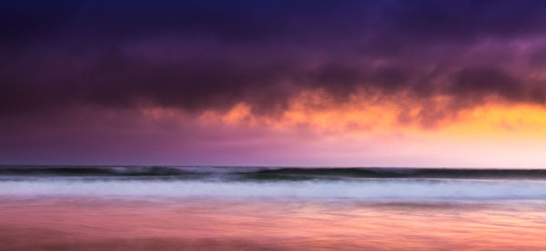 Scenic view of sea against dramatic sky