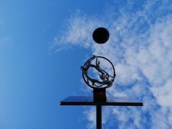Low angle view of basketball hoop against blue sky