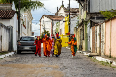 Group of people wearing carnival mask