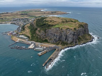 Aerial drone view of landmark the nut and the town of stanley on the north-west coast of tasmania.