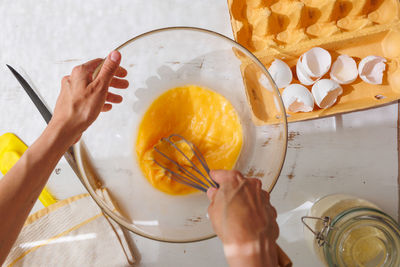 Cropped hand of woman holding fruit