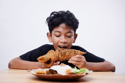 Portrait of woman eating food