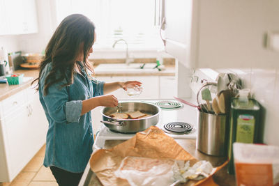 Woman preparing food at home