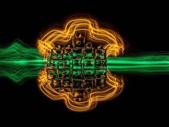 Illuminated light painting against black background